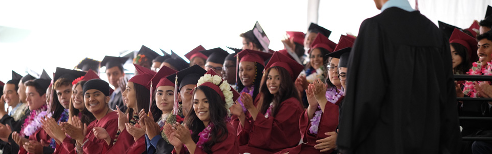 students at graduation in caps and gowns